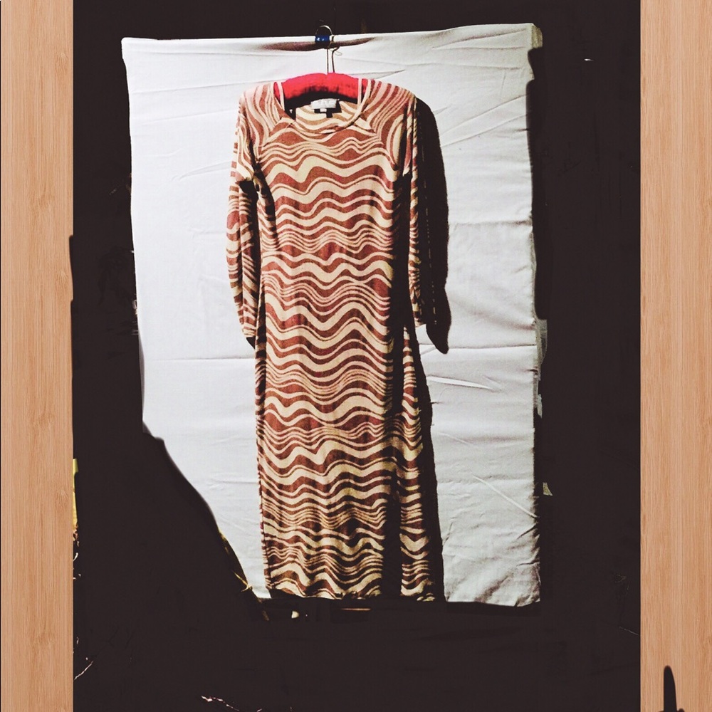 Form fitting dress by “SHE”